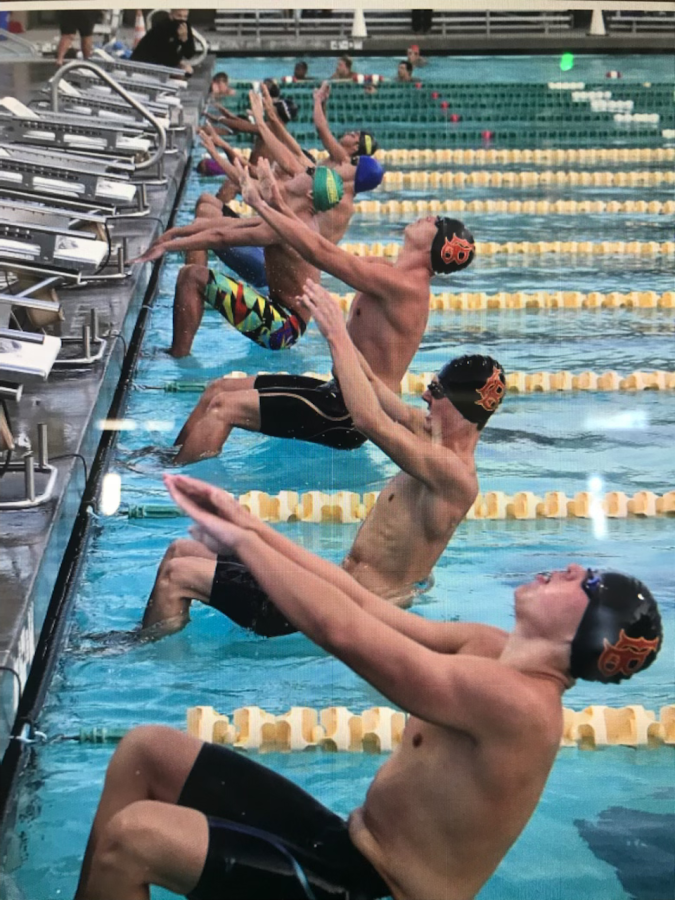 PHOTO COURTESY OF 562: 100 back stroke during the 2021 Moore League swim finals