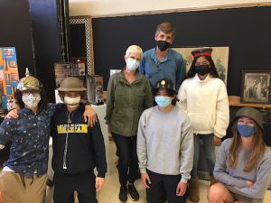 Photo of Quest World History Teacher Mr. Mulvehill and his class with the helmets on at the museum
Photo courtesy: Emma Lloyd
