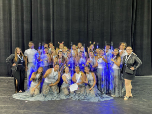 PHOTO COURTESY OF Jacquelyn Romano: The Color Guard team together after winning fourth place at the finals competition held at the UCI Bren Center.