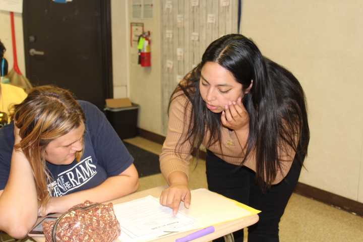 Ms. Bermudez individually working with one of her students.