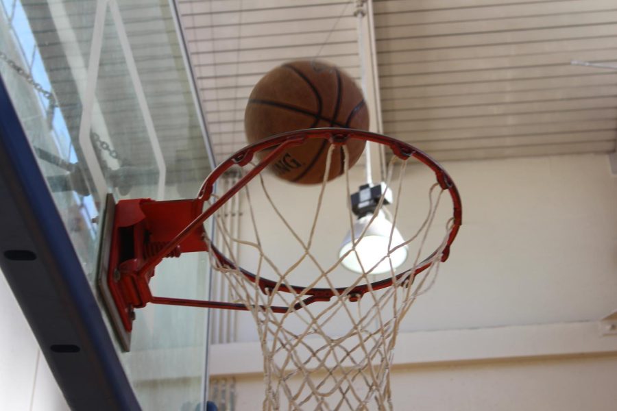 Photo of basketball being shot into net