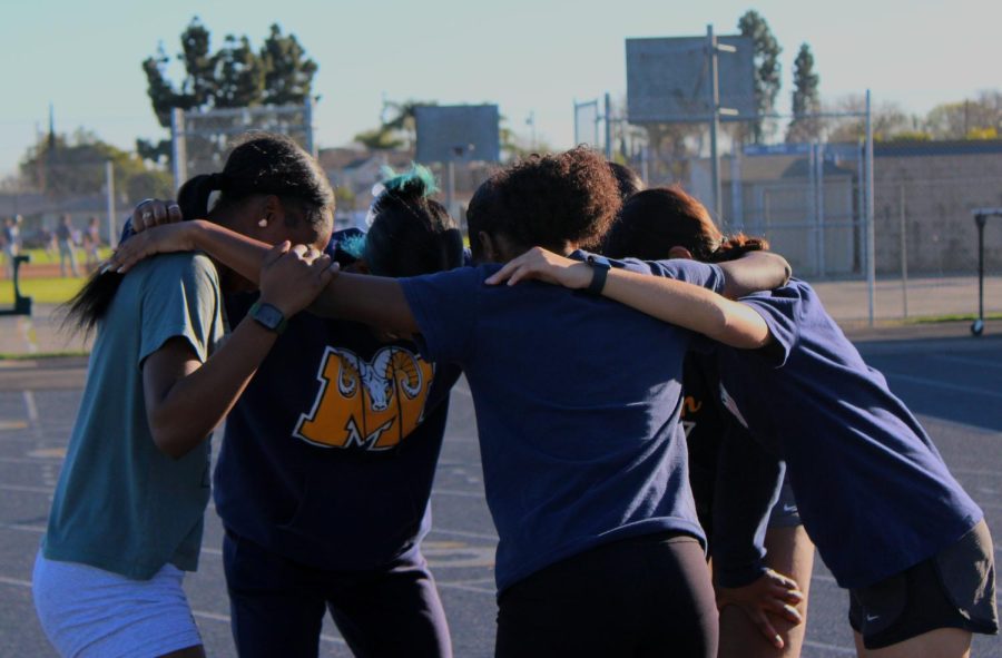 The Track and Field team in a huddle.