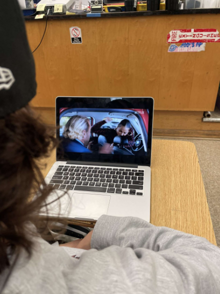 A student watching the movie You People.