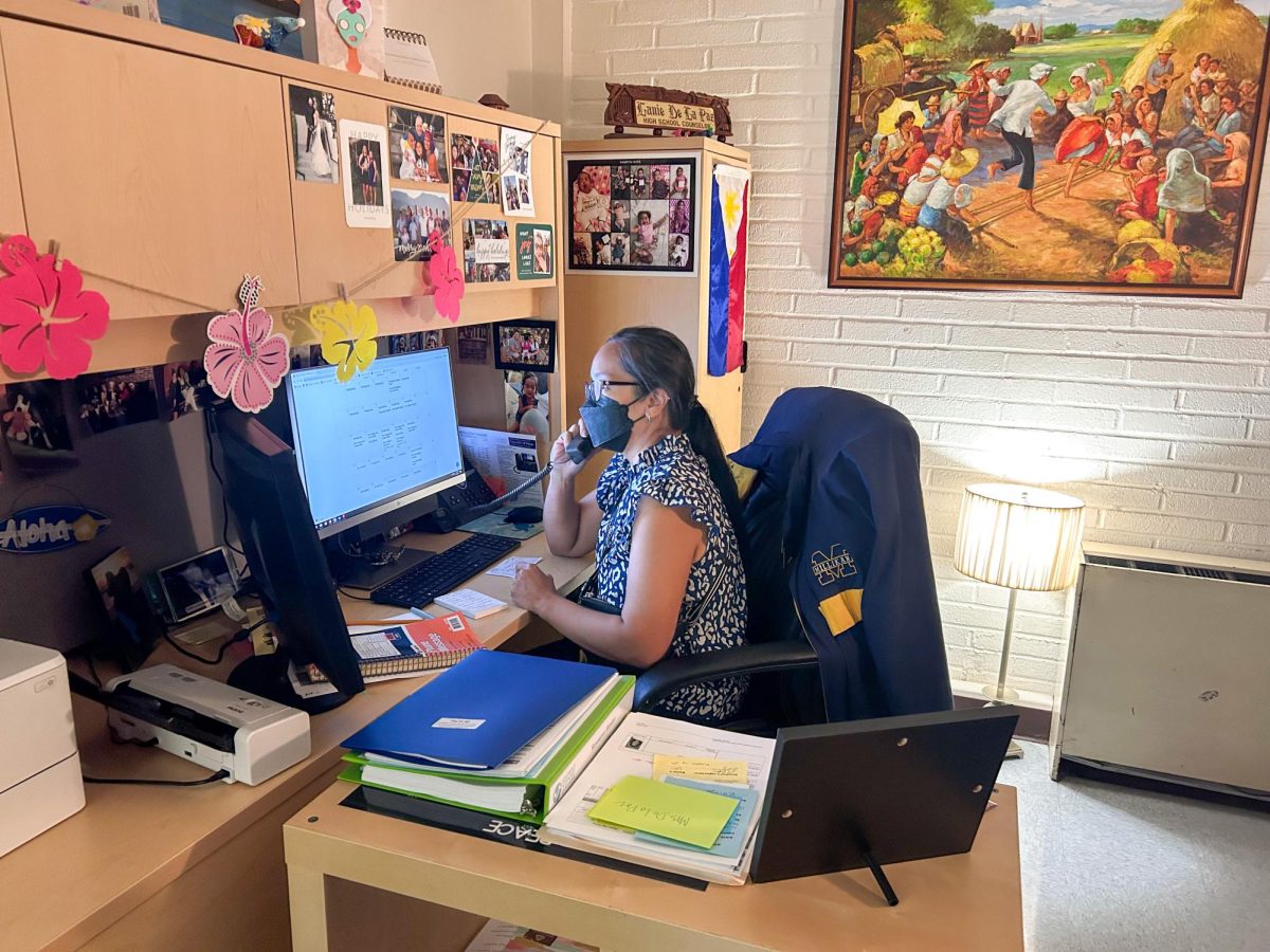 Photo of Ms. De La Paz, PEACE counselor, in her office.