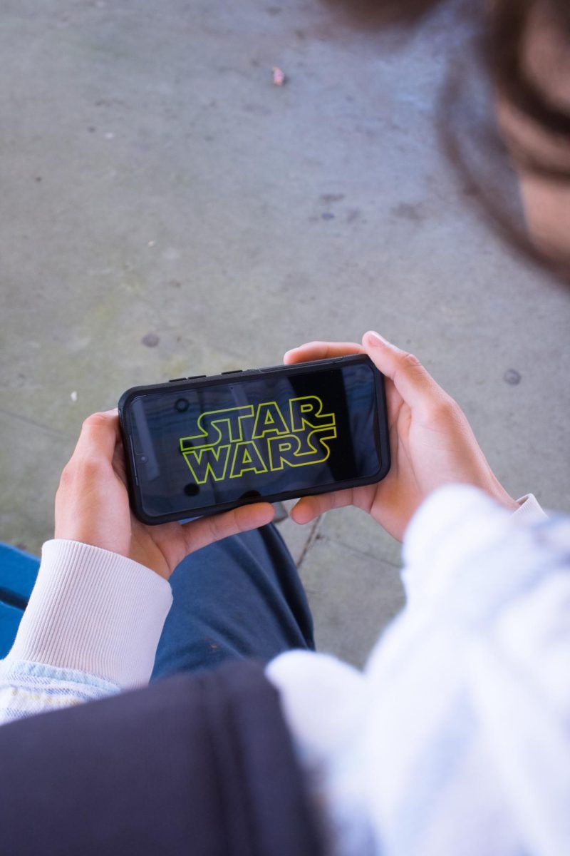 Photo of the Star Wars logo on a phone.