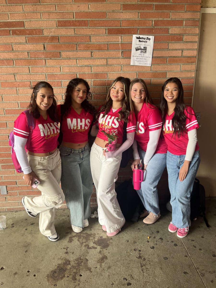 Millikan Cheerleaders,Bianca Arzate, Kailey Ortiz, Jessica Petersen, Ryley Thorne, and Chloe Vergara, wearing their pink uniforms in celebration of Valentines day. 