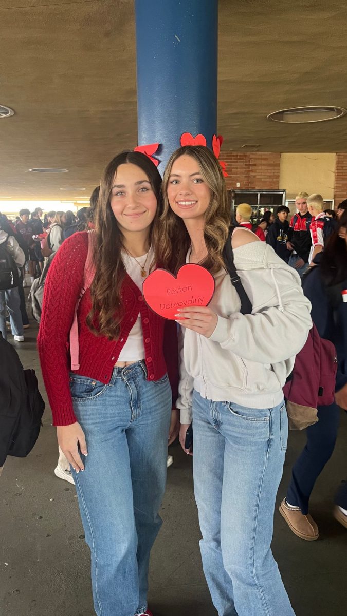 Zoey Roque and Peyton Dobrovolny celebrating with the hearts provided by ASB. 