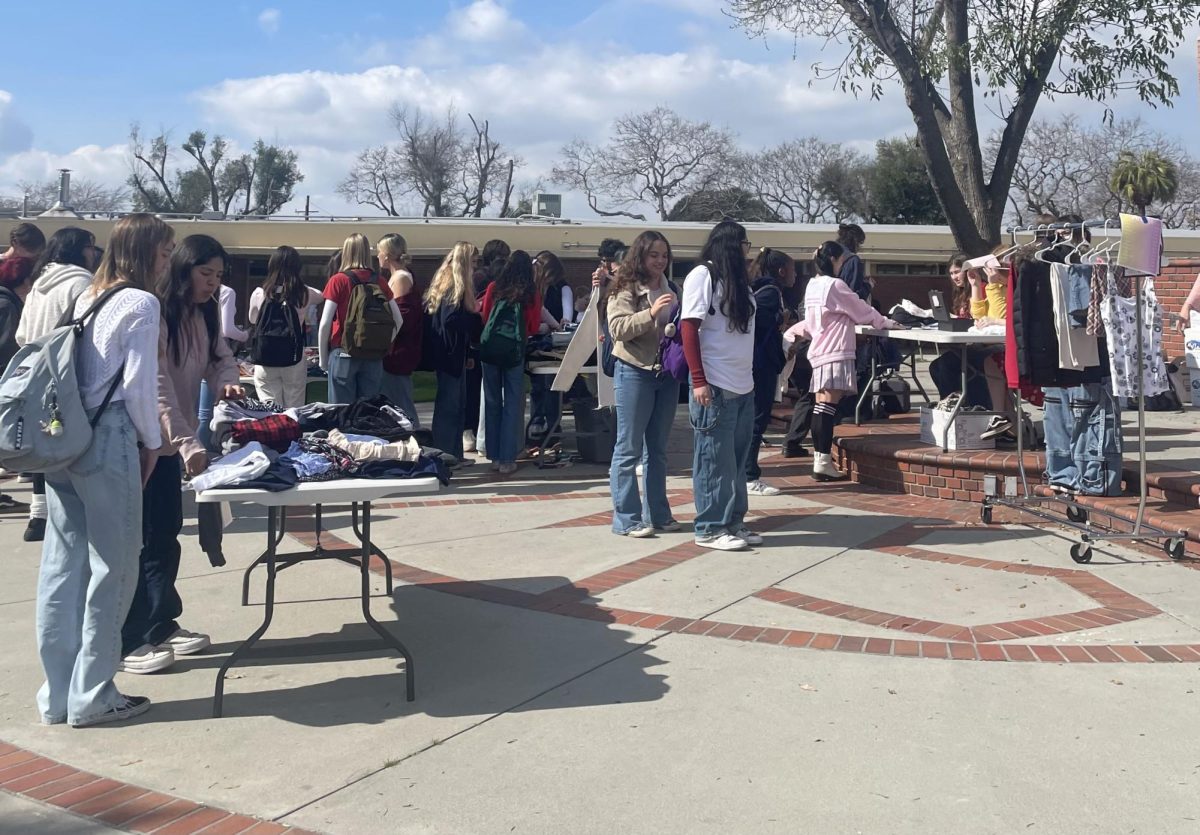 Photo of the rally stage packed with students supporting the fashion program. 