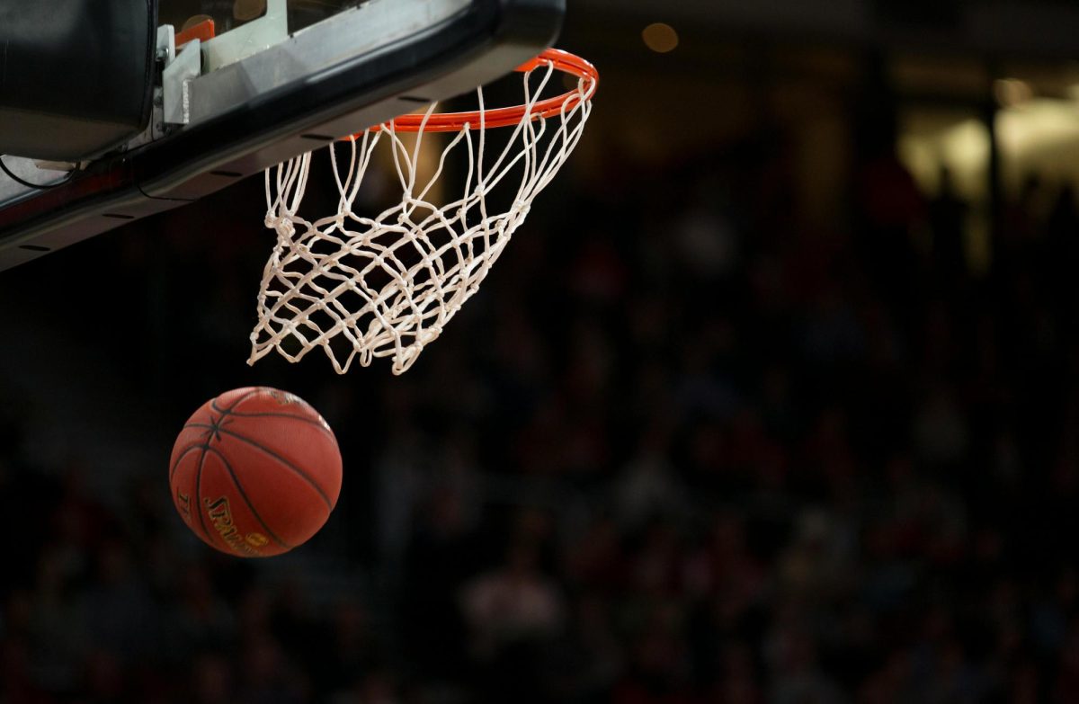 Photo of basketball going in the hoop (Pexels.com)