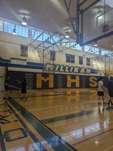 Players setting up nets for practice