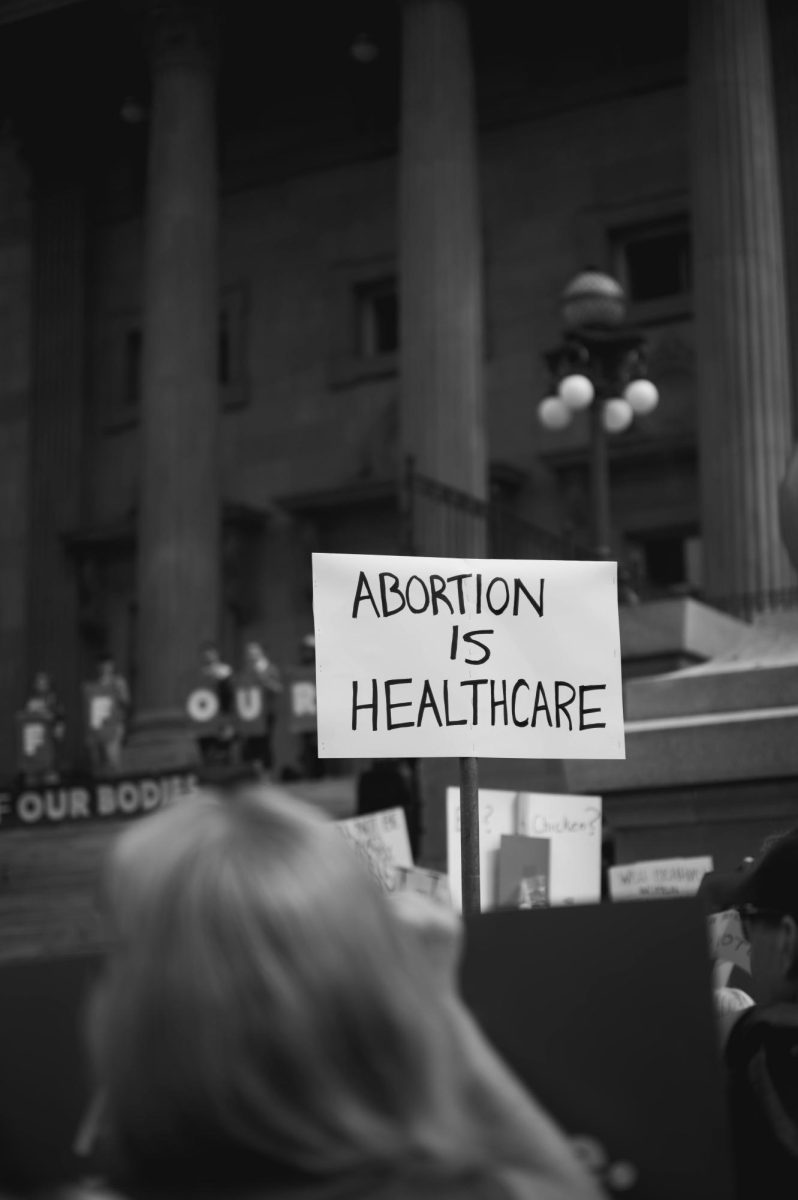 Photo of a protesters sign against abortion bans