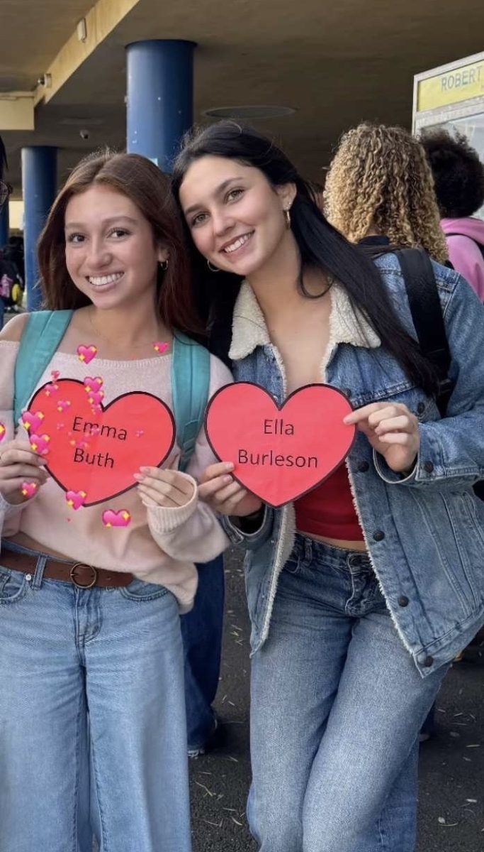 Two QUEST Seniors who found their name hearts during Valentines Day lunch