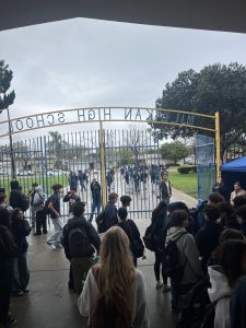 Students exiting through the front gate