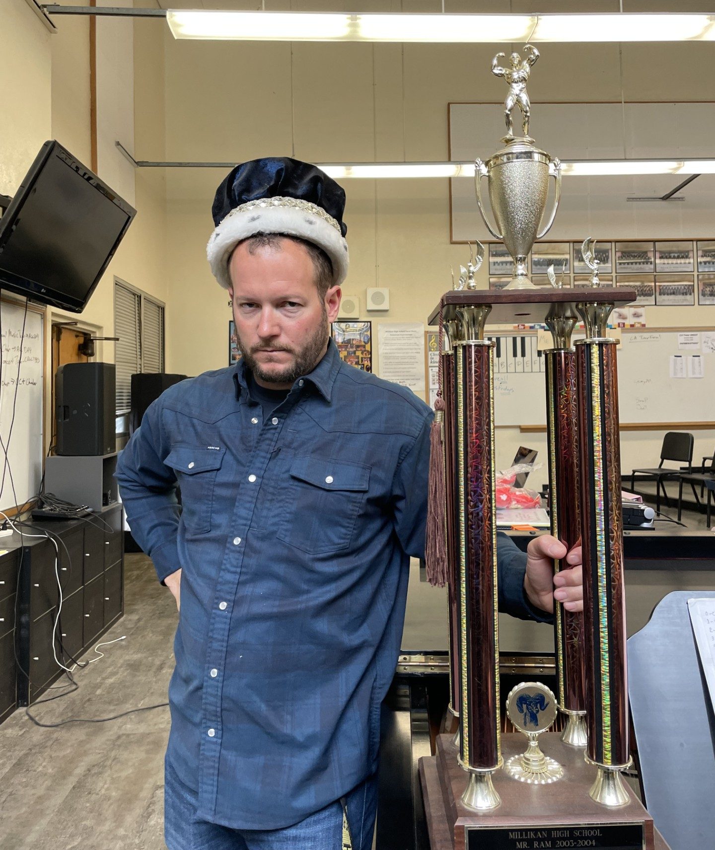 Millikan's choir teacher Mr. York, a previous Mr. Ram winner during the 2003-04 school year, with his trophy and crown