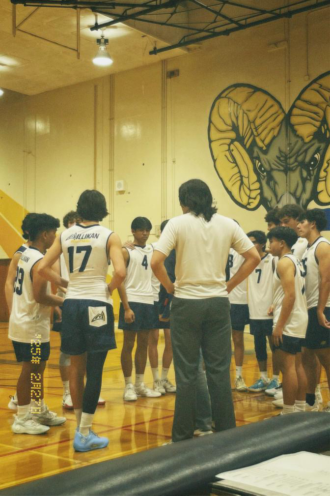 Photo of the Millikan Boys Volleyball team in a huddle. (Photo courtesy of Robert Lorenzana) 