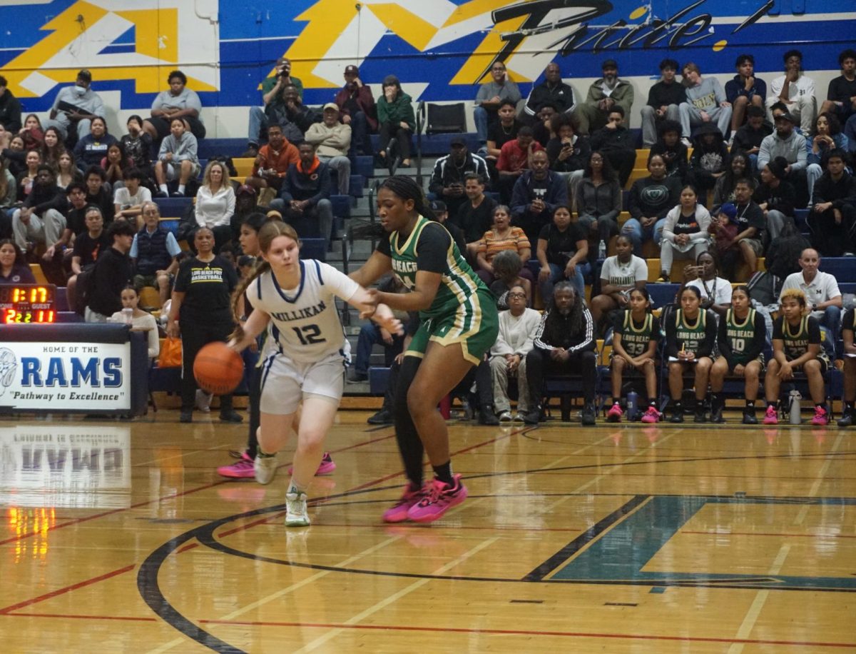 Senior Charlie Warner defending and scoring against Poly