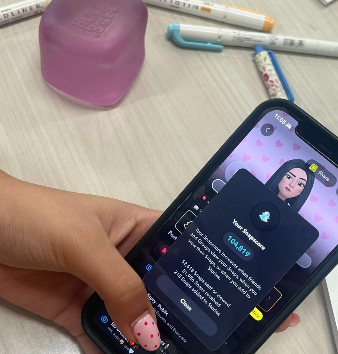 Photo of someone looking at their snap-score. 