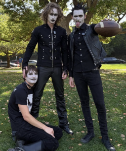 Photo of three YouTubers dressed up as goth scream-O guys for a video.